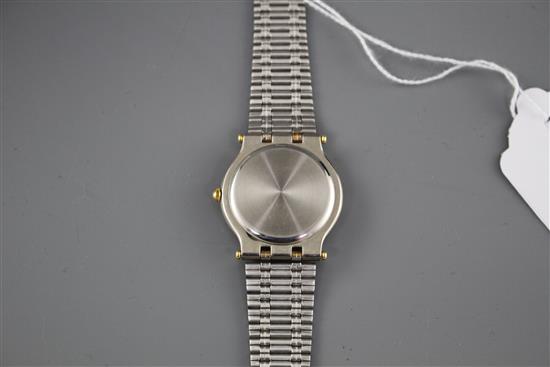 A modern stainless steel and yellow metal Gucci quartz dress wristwatch, on steel and yellow metal bracelet,